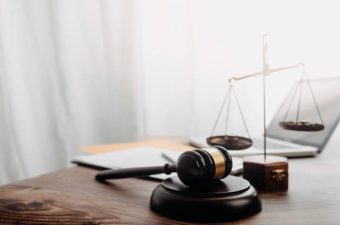istockphoto-1325676218-612×612 Business and lawyers discussing contract papers with brass scale on desk in office. Law, legal services, advice, justice and law concept picture with film grain effect